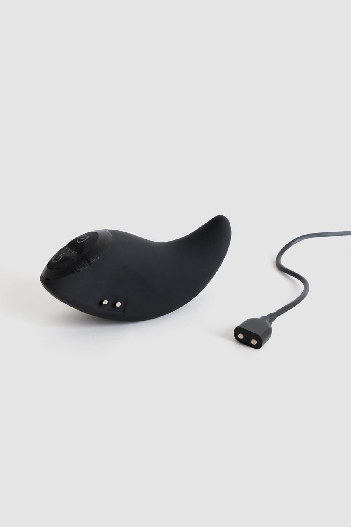 a pair of black scissors sitting on top of a white surface